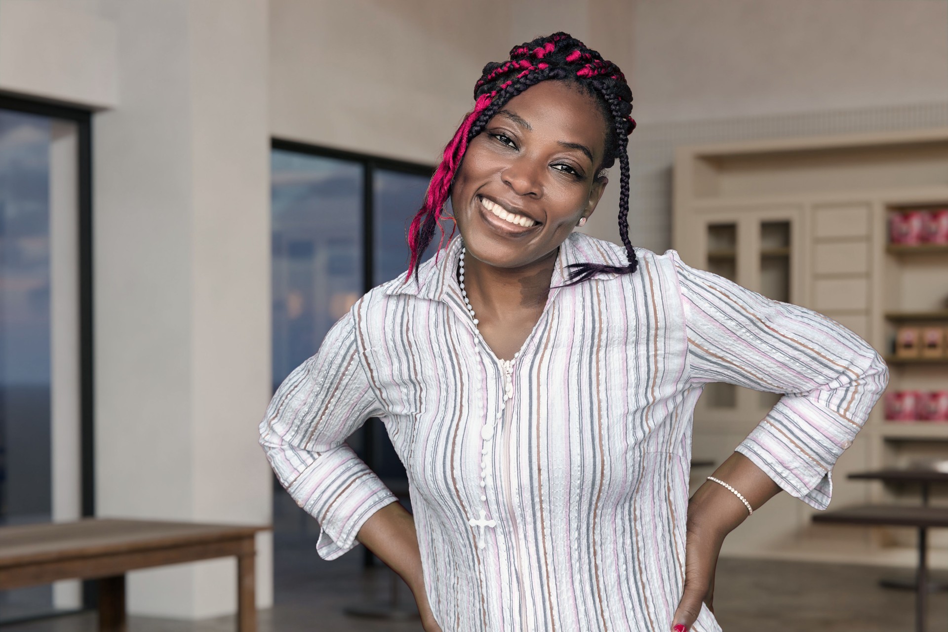Female Restaurant Owner with Colorful Braids in Her Business